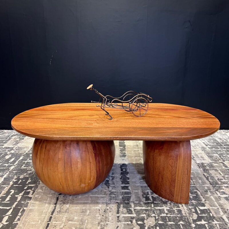 An oval mahogany coffee table