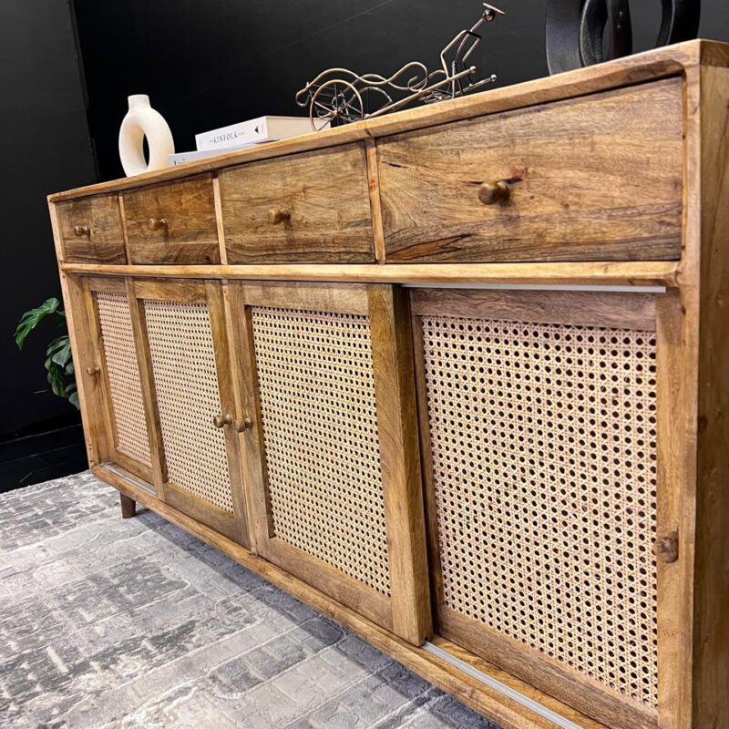 A mango wood console with rattan