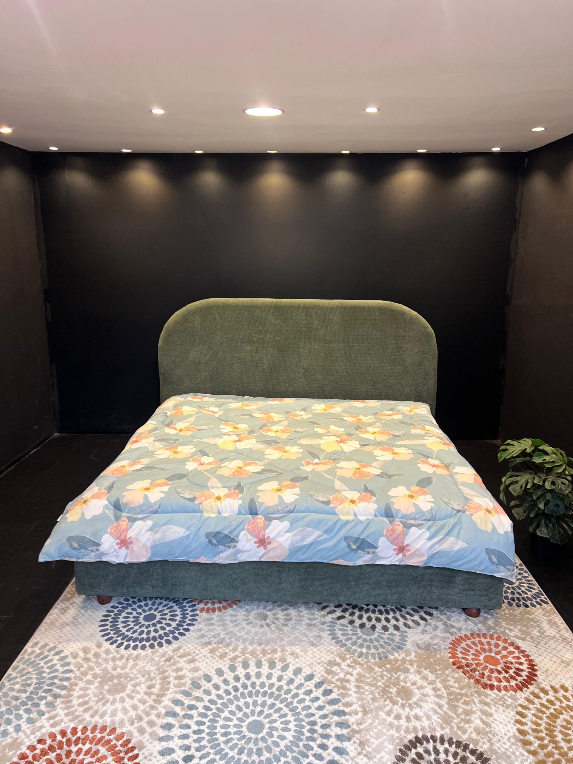 Dark green fabric bed